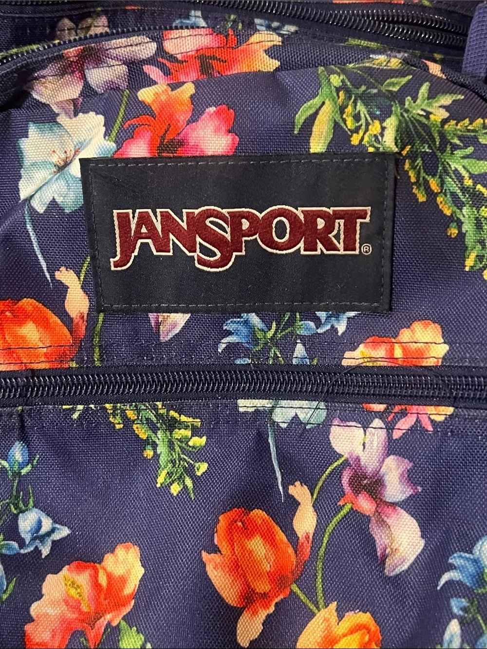 Jansport Navy Backpack with Colorful Floral Print